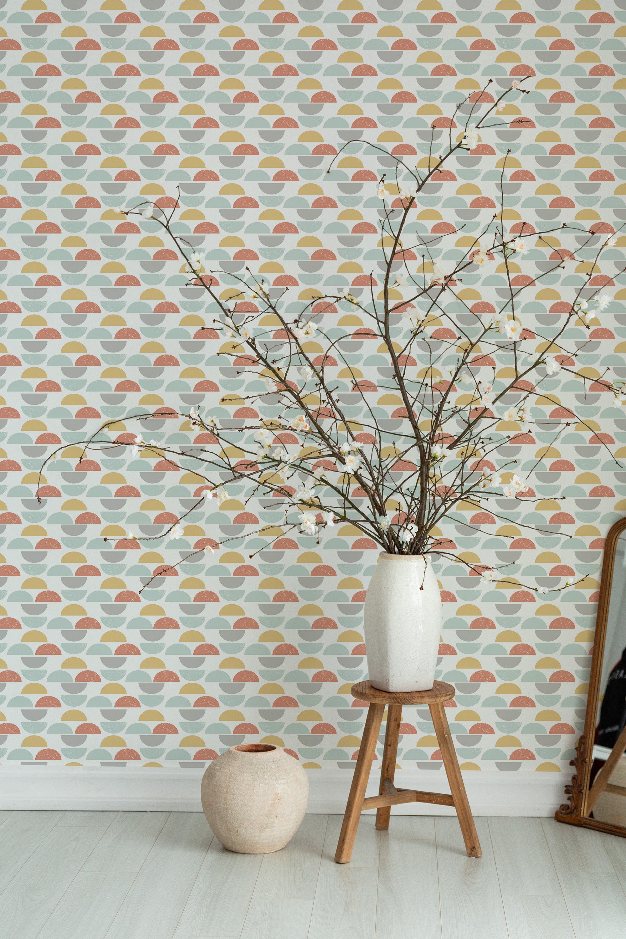 Self-adhesive wallpaper with a colorful boho circle pattern in warm, earthy tones, including terracotta, mustard, and sage green on a light background. The design creates a retro-inspired, relaxing atmosphere.