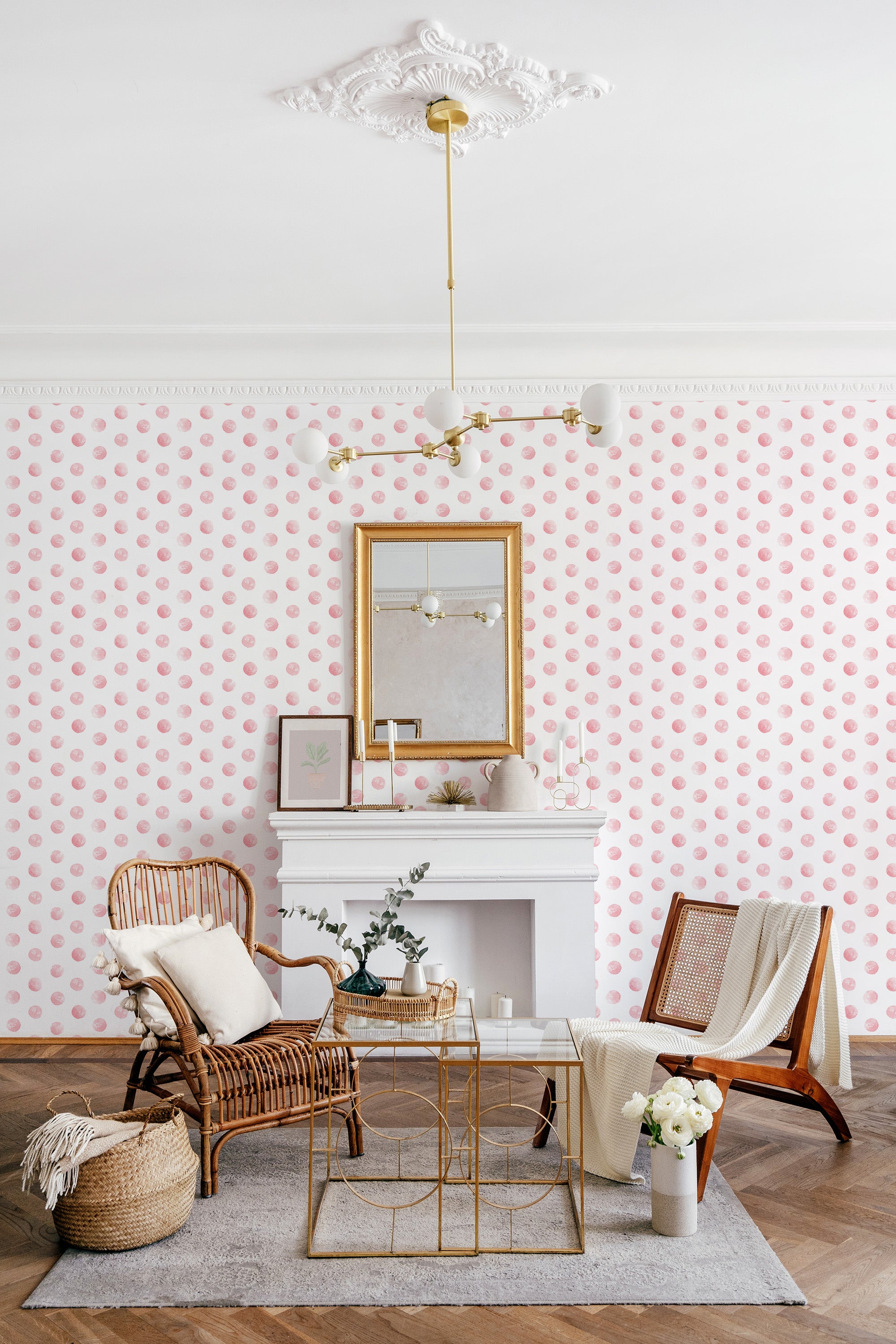 Wallpaper with a pattern of soft pink watercolor polka dots evenly spaced against a white background, giving the room a playful and modern yet elegant feel. Traditional wallpaper.