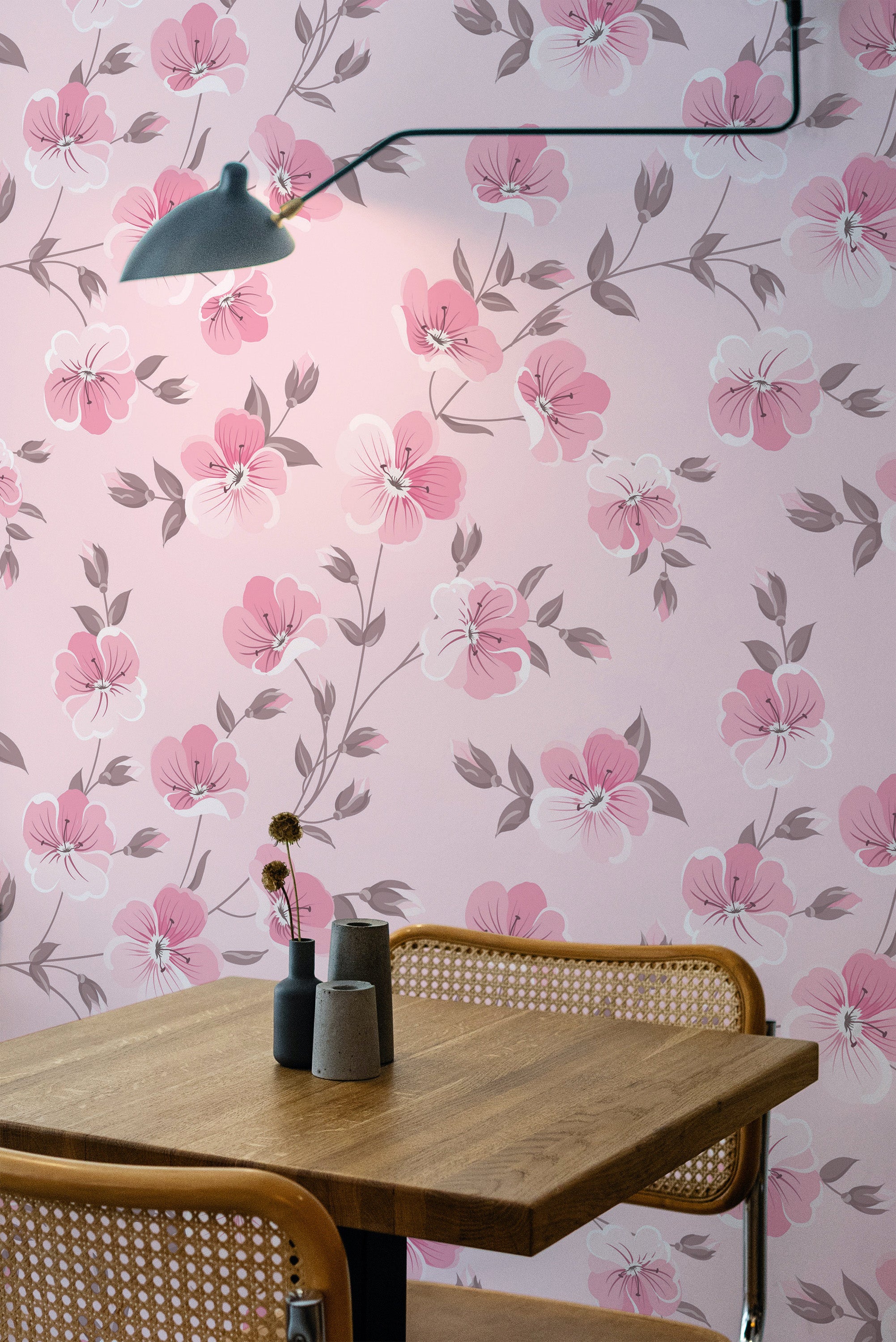 Self-adhesive pink floral wallpaper with light pink flowers and subtle grey leaves on a soft pink background.