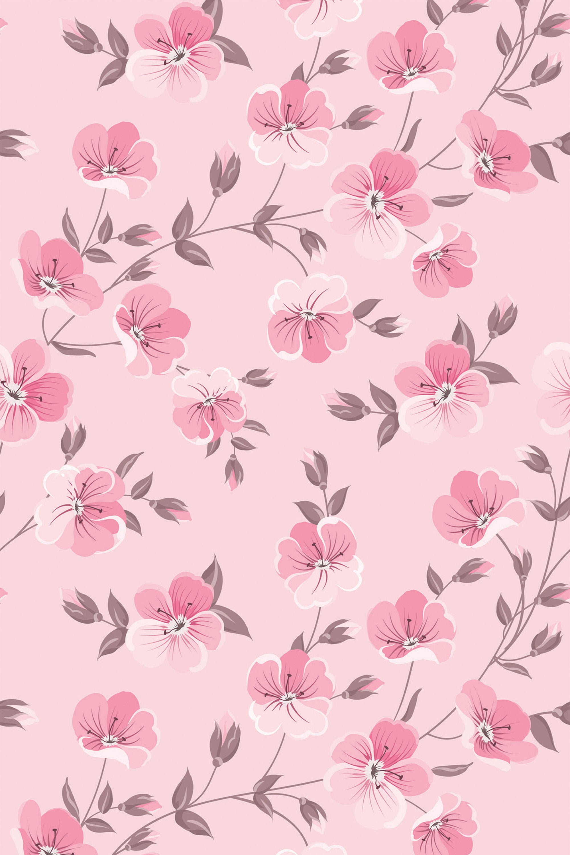 Pink floral wallpaper with delicate, scattered flowers in various shades of pink, accompanied by soft green leaves on a light pink background. Peel and stick removable wallpaper.