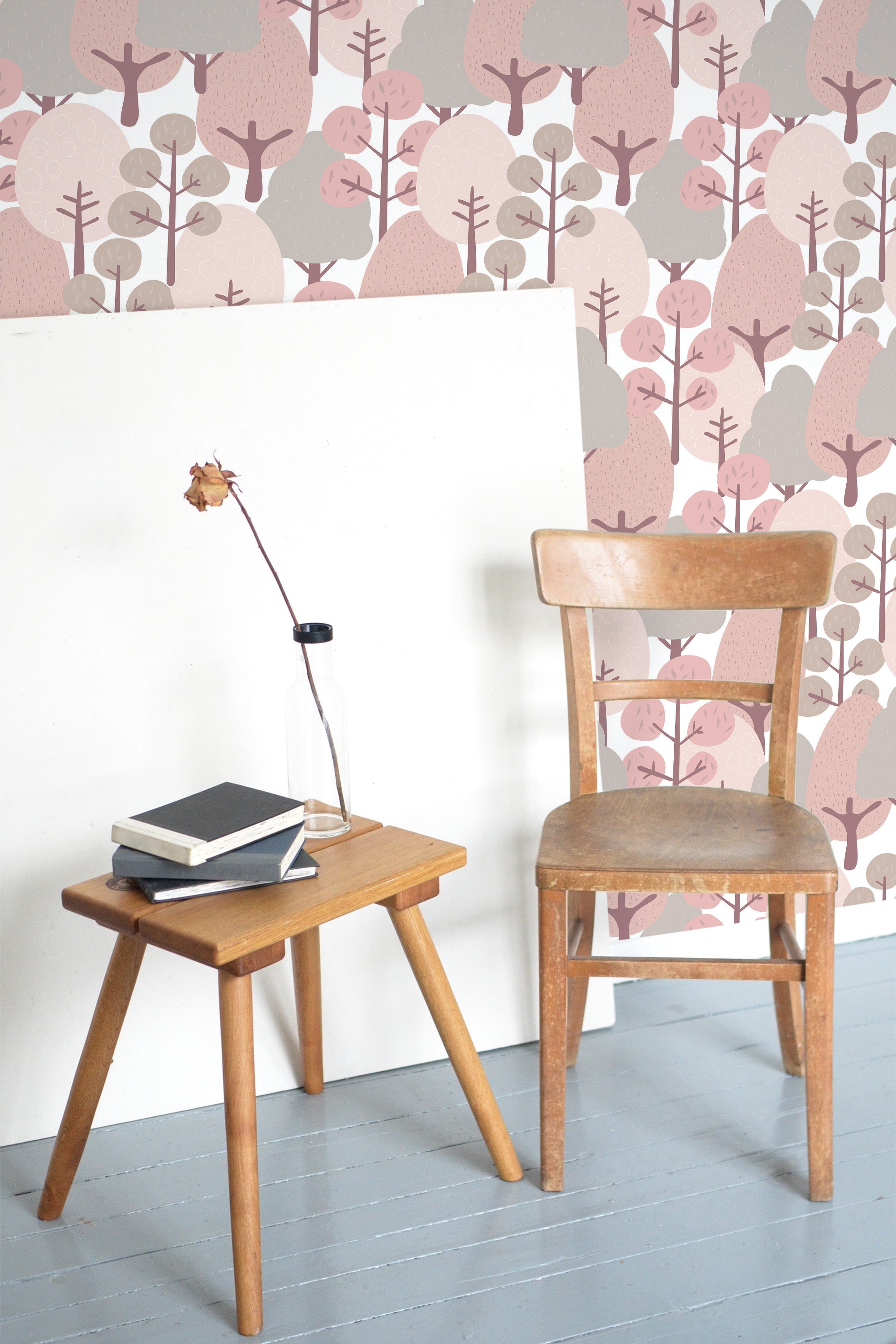 Self-adhesive wallpaper with a whimsical fairytale forest design, featuring stylized trees and soft hues of pink, brown, and gray, creating a playful and calming atmosphere.