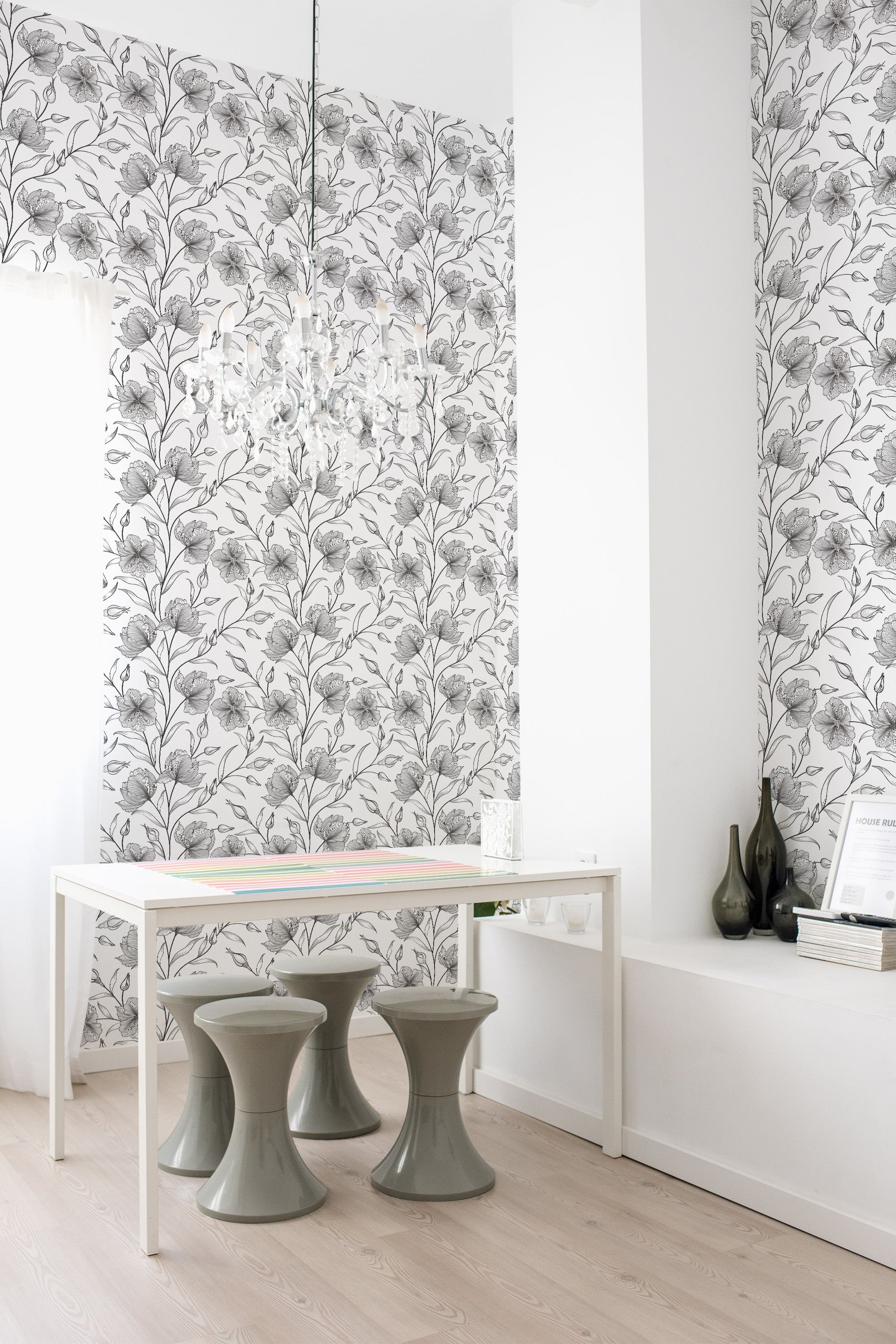 Floral wallpaper with intricate black and white botanical patterns, covering the walls of a modern, minimalist room with neutral tones. Traditional wallpaper.