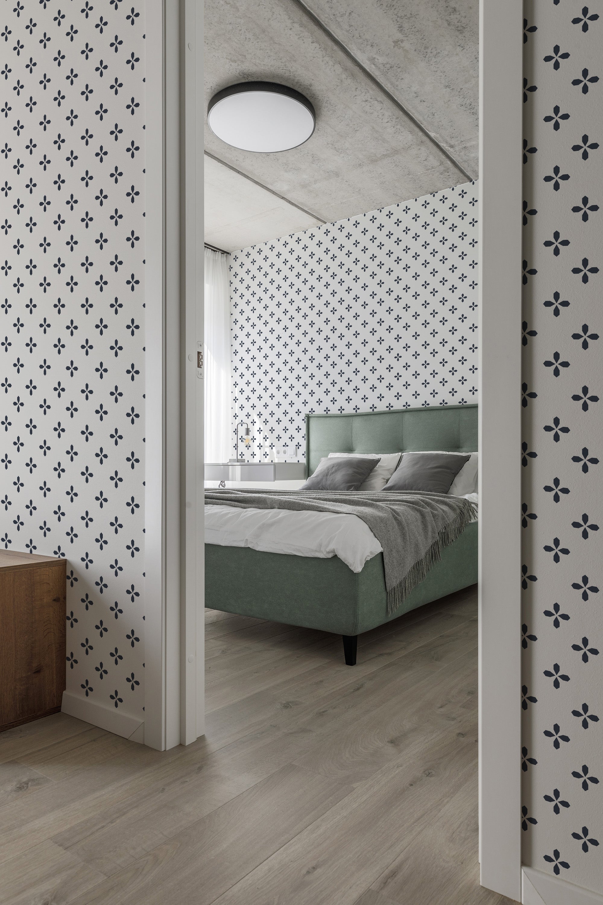 The wallpaper in the room has a Blue Geometric design with repeating small floral-like patterns on a white background, enhancing a modern yet classic look. Traditional wallpaper.