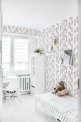 Wallpaper with vertical patterns of abstract tree motifs, arranged in a repeating sequence, in soft beige tones on a white background, creating a subtle and calming atmosphere. Traditional wallpaper.