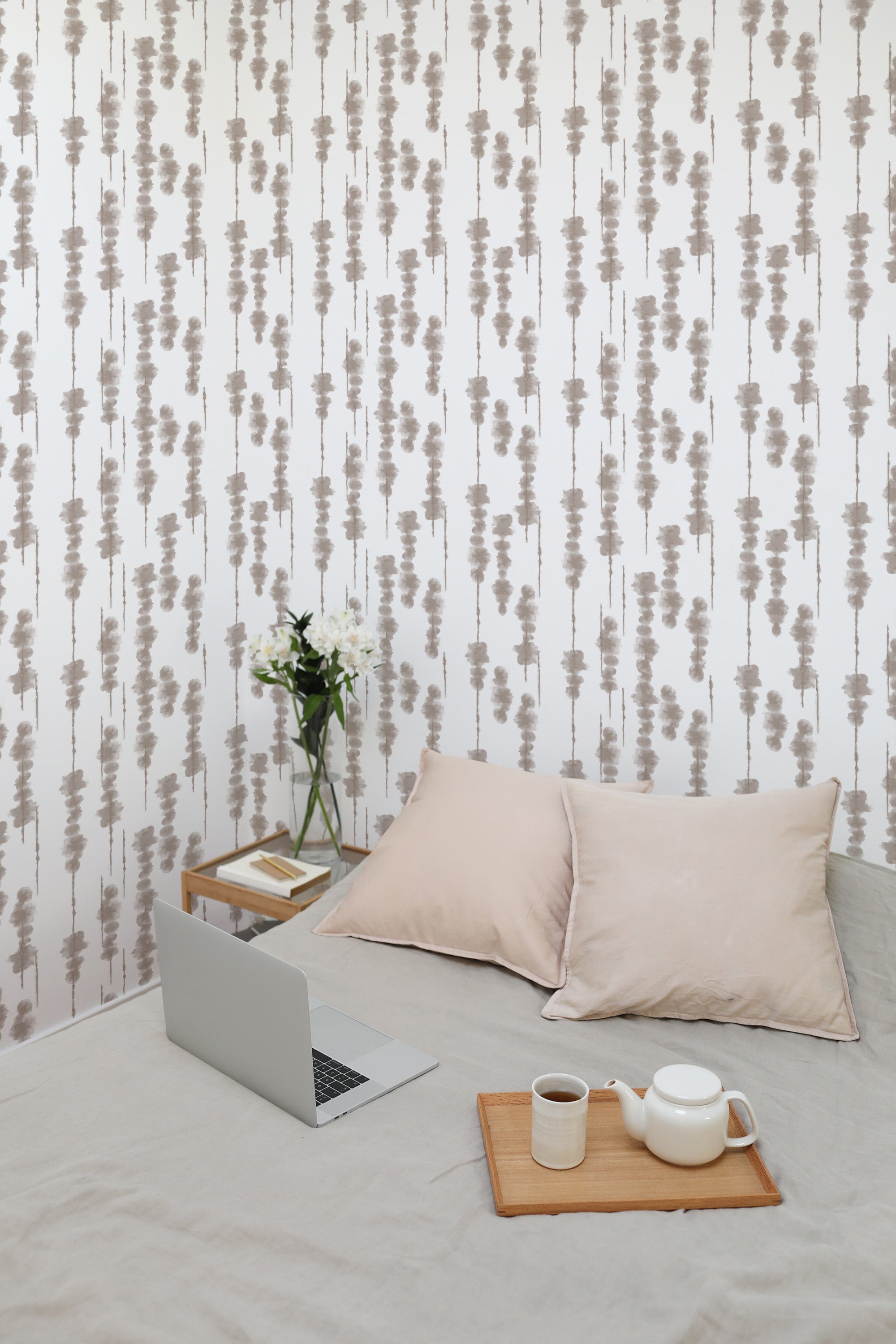 Self-adhesive wallpaper with an abstract tree design in neutral tones, combining vertical lines with subtle, organic shapes that create a calming atmosphere.