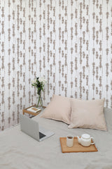 Self-adhesive wallpaper with an abstract tree design in neutral tones, combining vertical lines with subtle, organic shapes that create a calming atmosphere.