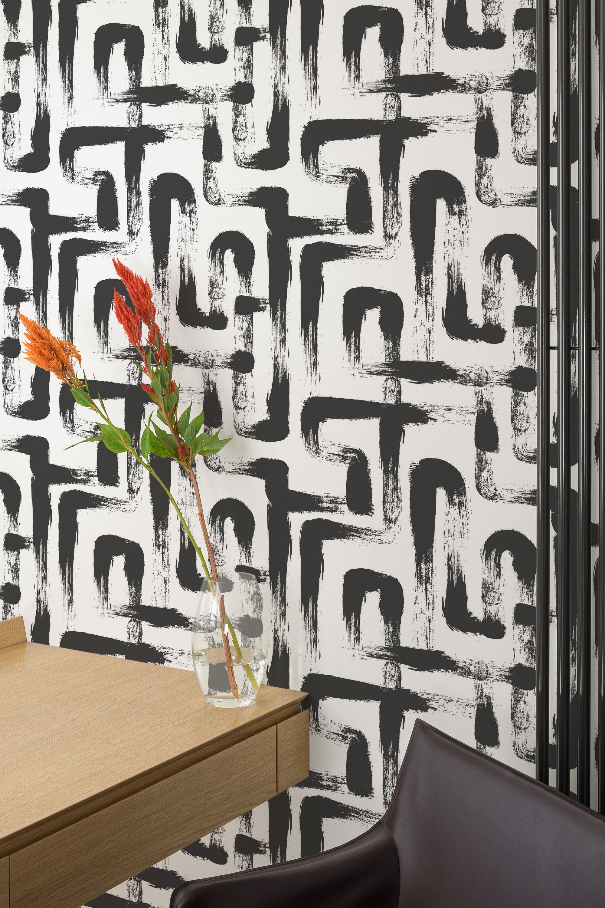 Self-adhesive wallpaper with abstract black brush stroke lines forming bold geometric patterns against a white background.