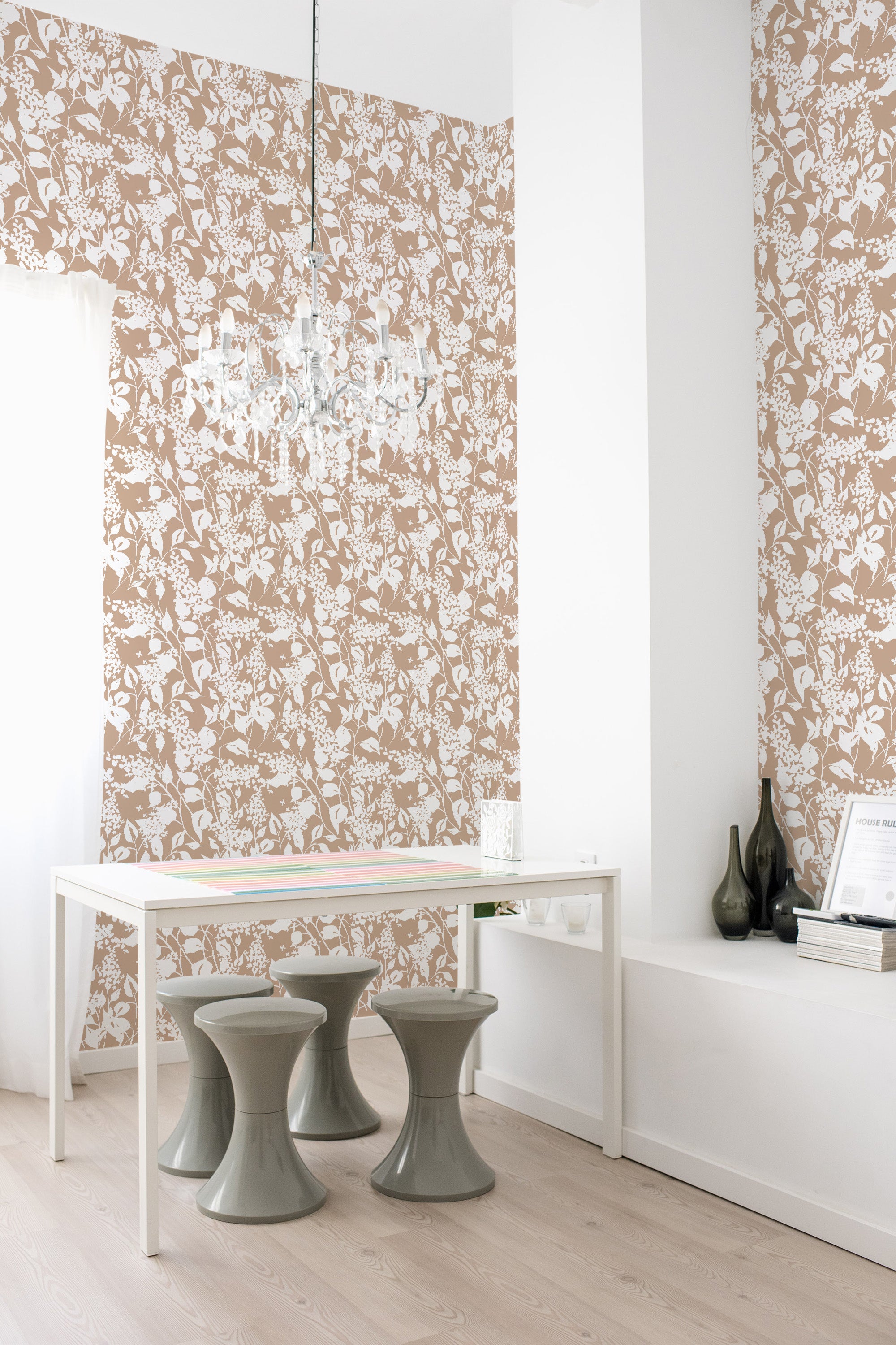 A room with brown wallpaper adorned with intricate white floral patterns, creating an old-school, vintage feel. This is traditional wallpaper.
