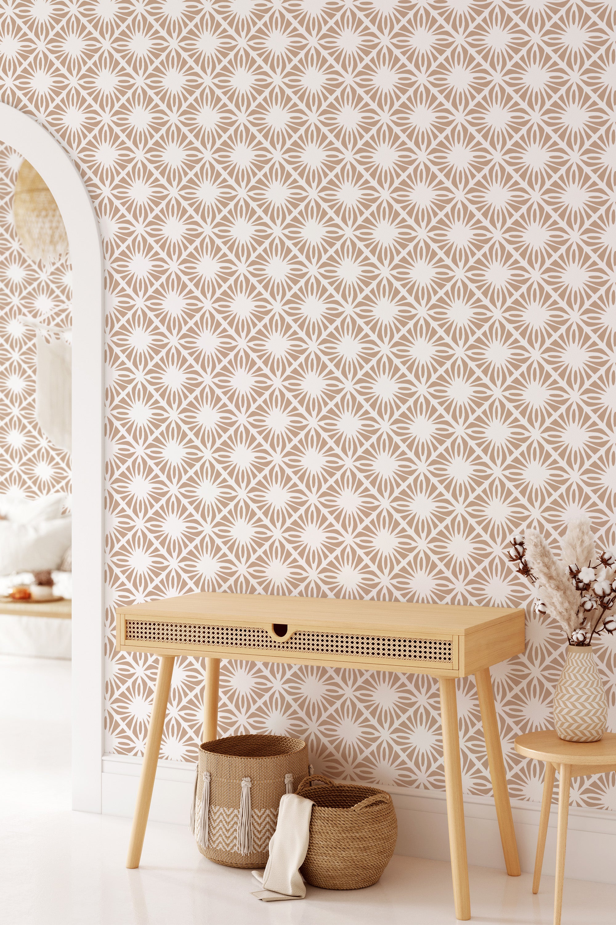 A room with walls covered in Moroccan tile patterned wallpaper, incorporating interlocking geometric shapes in subdued tones, complemented by a modern console table and decorative items, invoking a blend of contemporary and traditional wallpaper.