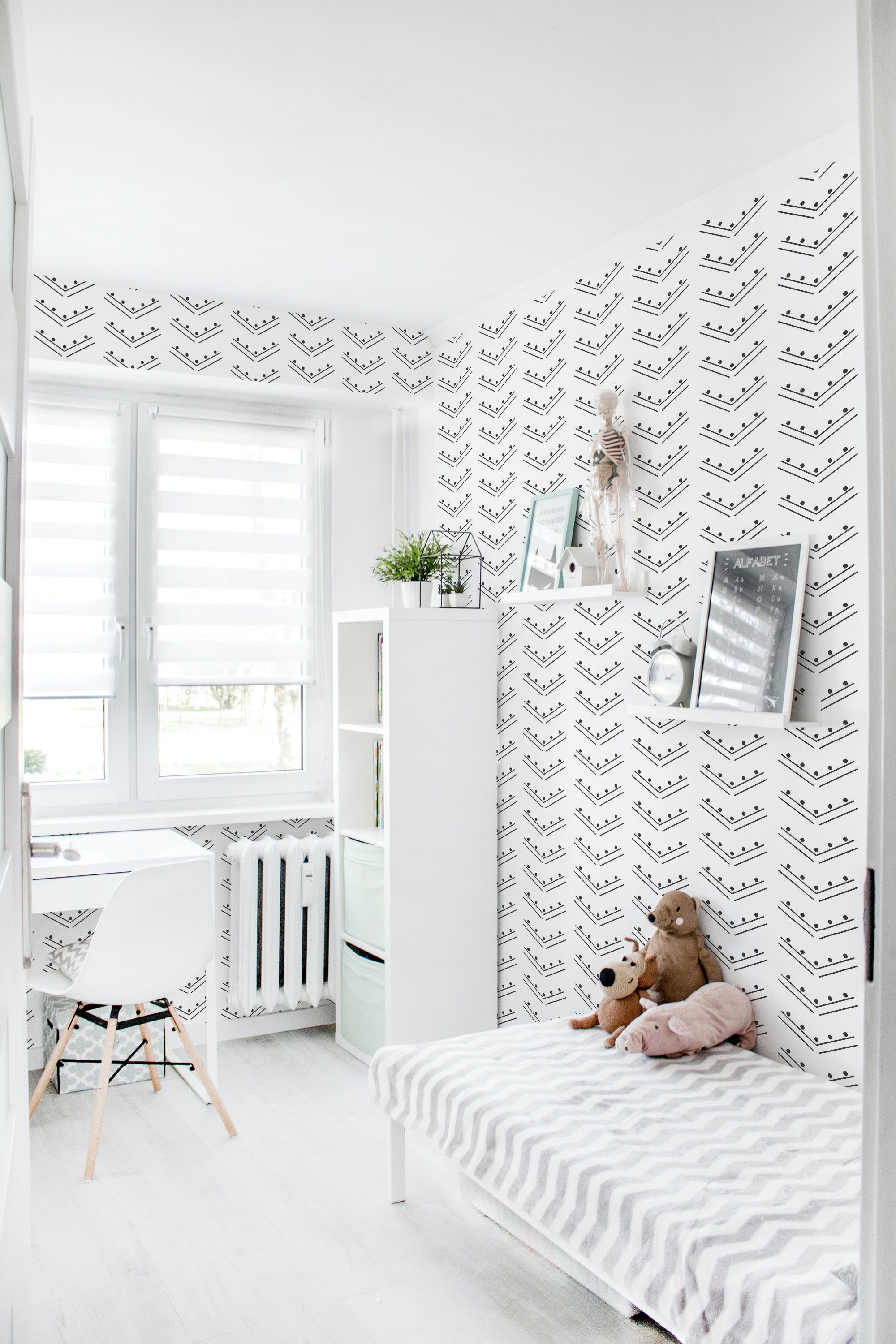 A bright room with walls covered in herringbone dots patterned wallpaper, combining clean lines and simple dots in a monochrome color scheme, giving a modern twist to traditional wallpaper.