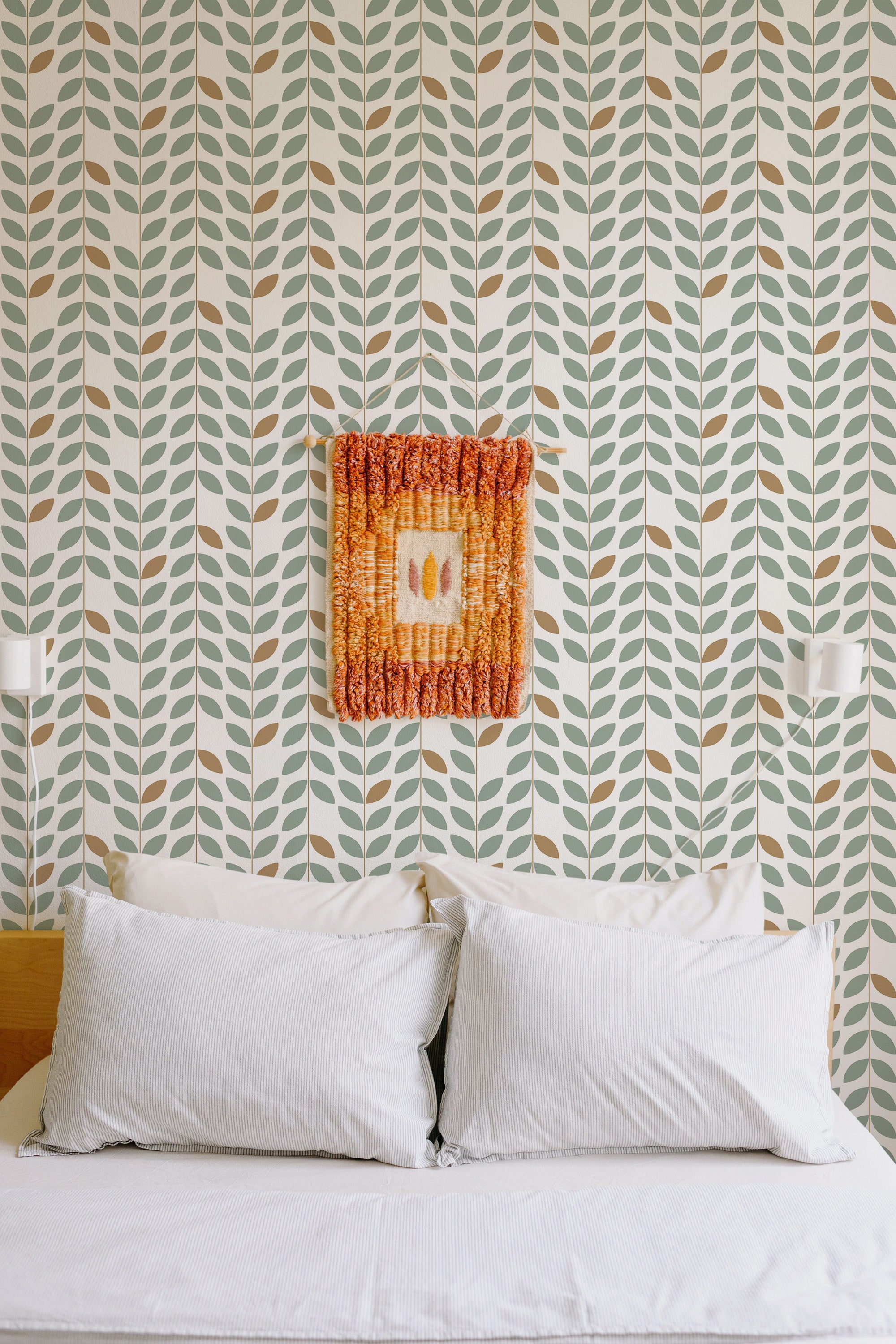Self-adhesive Mid-century stripe wallpaper with vertical rows of stylized green leaves against a white background in a cozy room setting.