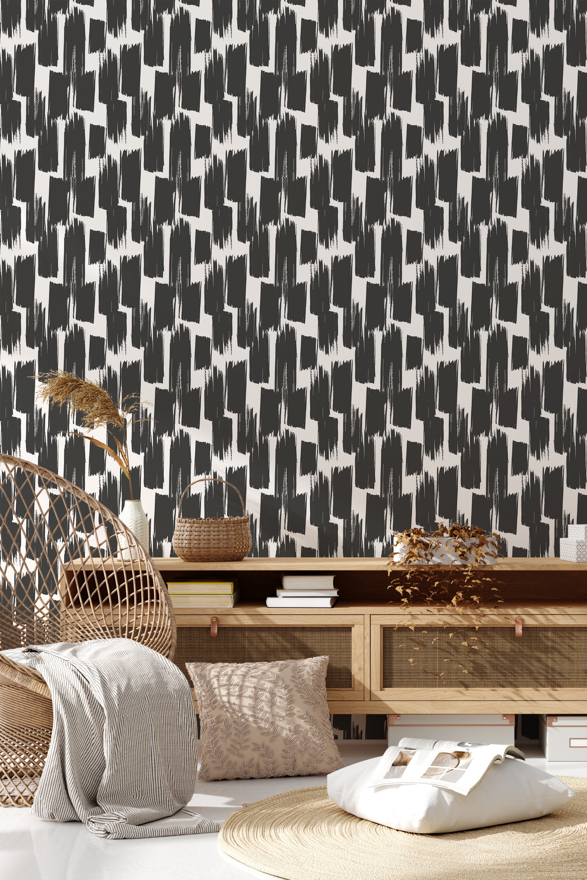 Bold brushstroke patterned wallpaper in black and white adorns the wall, providing a modern twist on traditional wallpaper.