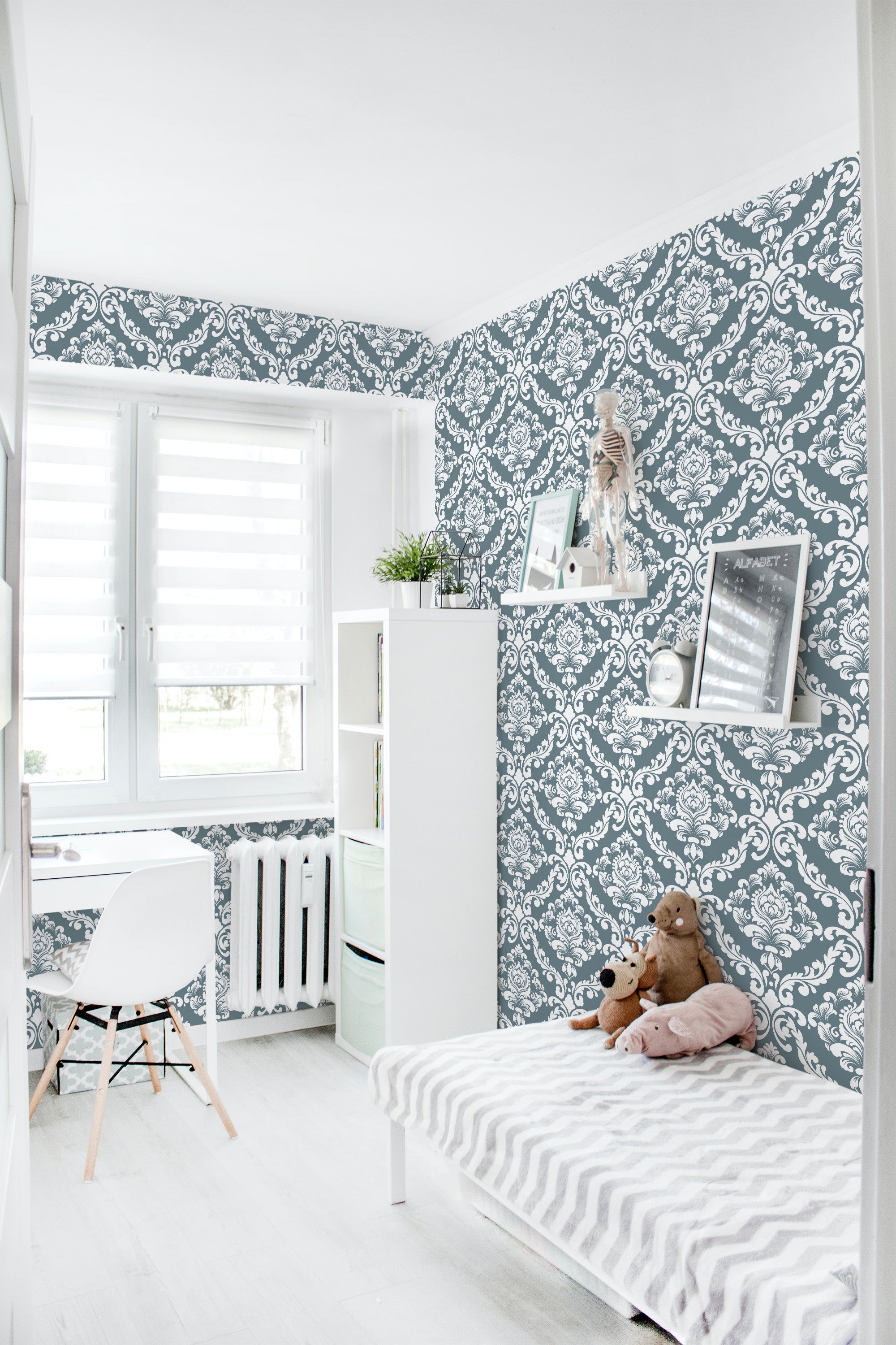 A bright room with a wall covered in blue and white vintage damask pattern wallpaper, giving a classic and elegant feel, traditional wallpaper.