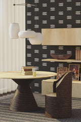 A room's wall adorned with a traditional wallpaper pattern consisting of horizontal brush stroke stripes against a solid background.