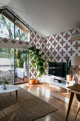 A room with Bold tile wallpaper in a pattern of large brown and beige floral designs on a white background, adding texture and warmth to the space, traditional wallpaper.
