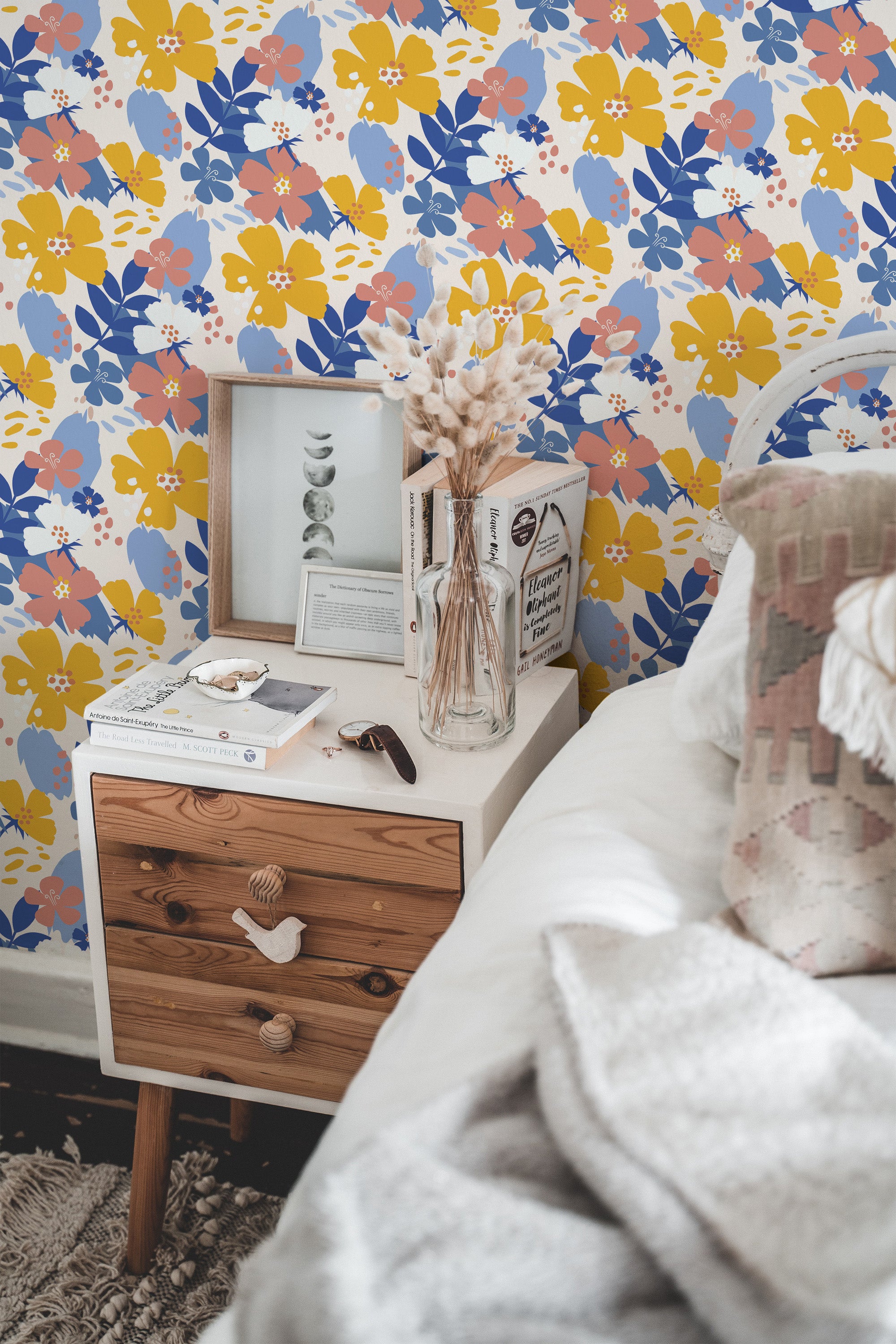 Self-adhesive wallpaper with a vibrant 'Colorful Spring' pattern including blue, yellow, and red flowers against a grey background, adding a lively touch to the room's decor.