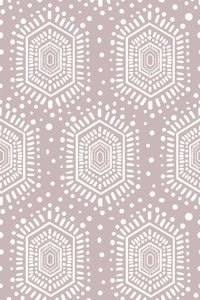 A pattern of white geometric mandala-inspired motifs on a taupe background, peel and stick removable wallpaper.