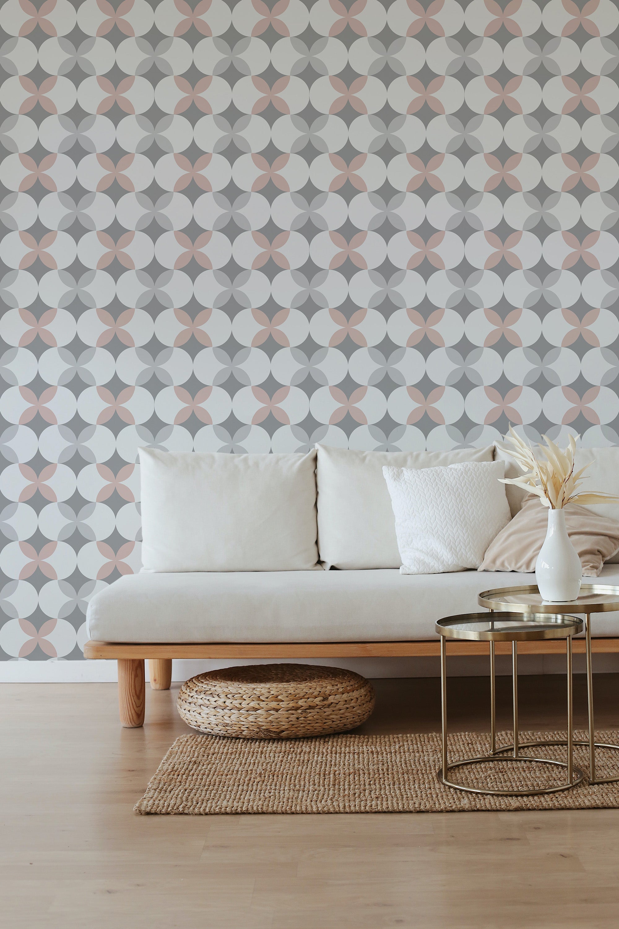 A room with a wall covered in dotted retro print wallpaper, incorporating a pattern of overlapping circles in muted colors, providing a vintage feel to the room's aesthetic as a traditional wallpaper.