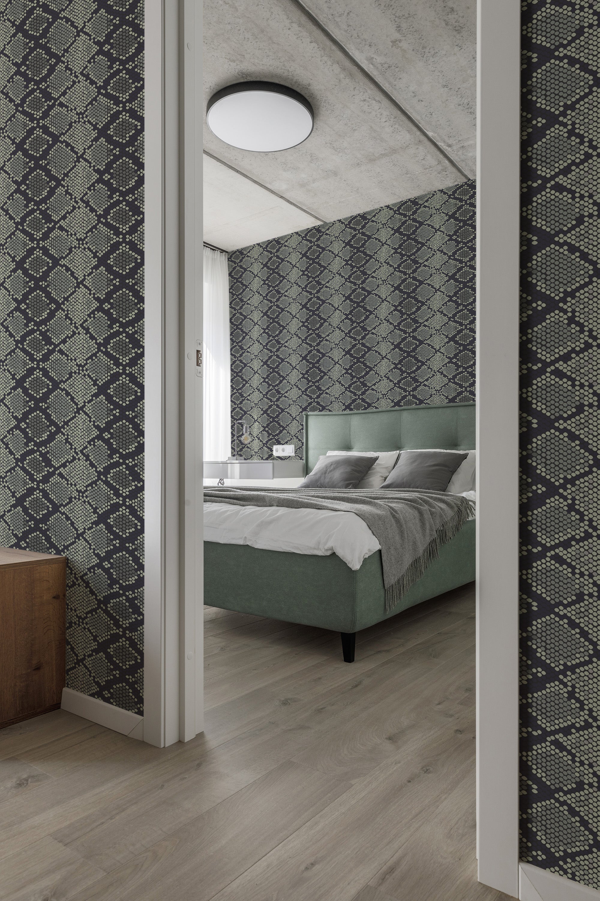 A bedroom with walls covered in dark snake skin patterned traditional wallpaper, complementing the modern decor and green upholstered bed.