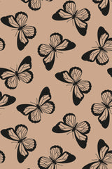A pattern of large black and white butterflies on a warm beige background, designed as a peel and stick removable wallpaper.