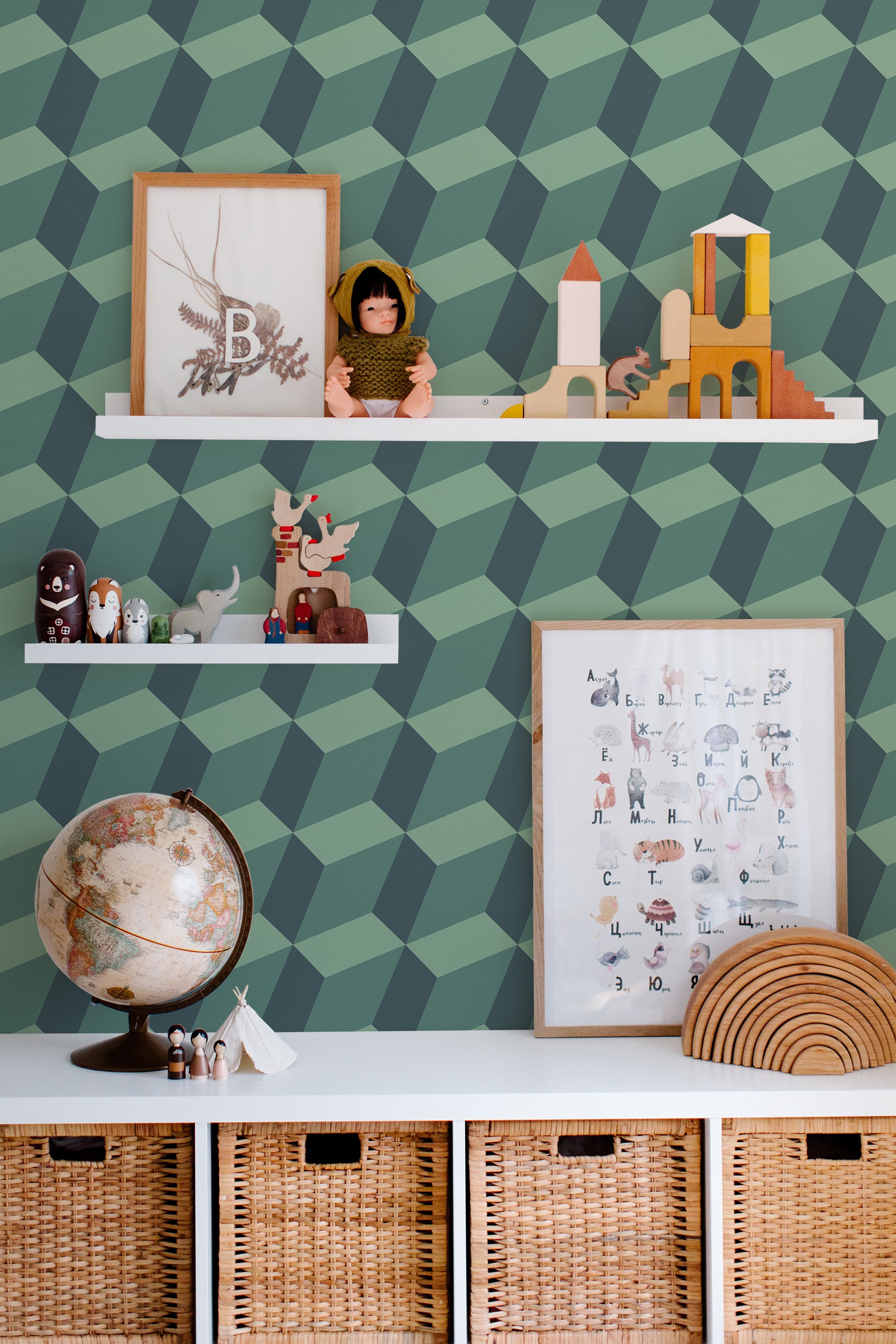 Self-adhesive wallpaper with a geometric pattern in shades of green creating a modern and sophisticated ambiance in a room with children's decor elements.