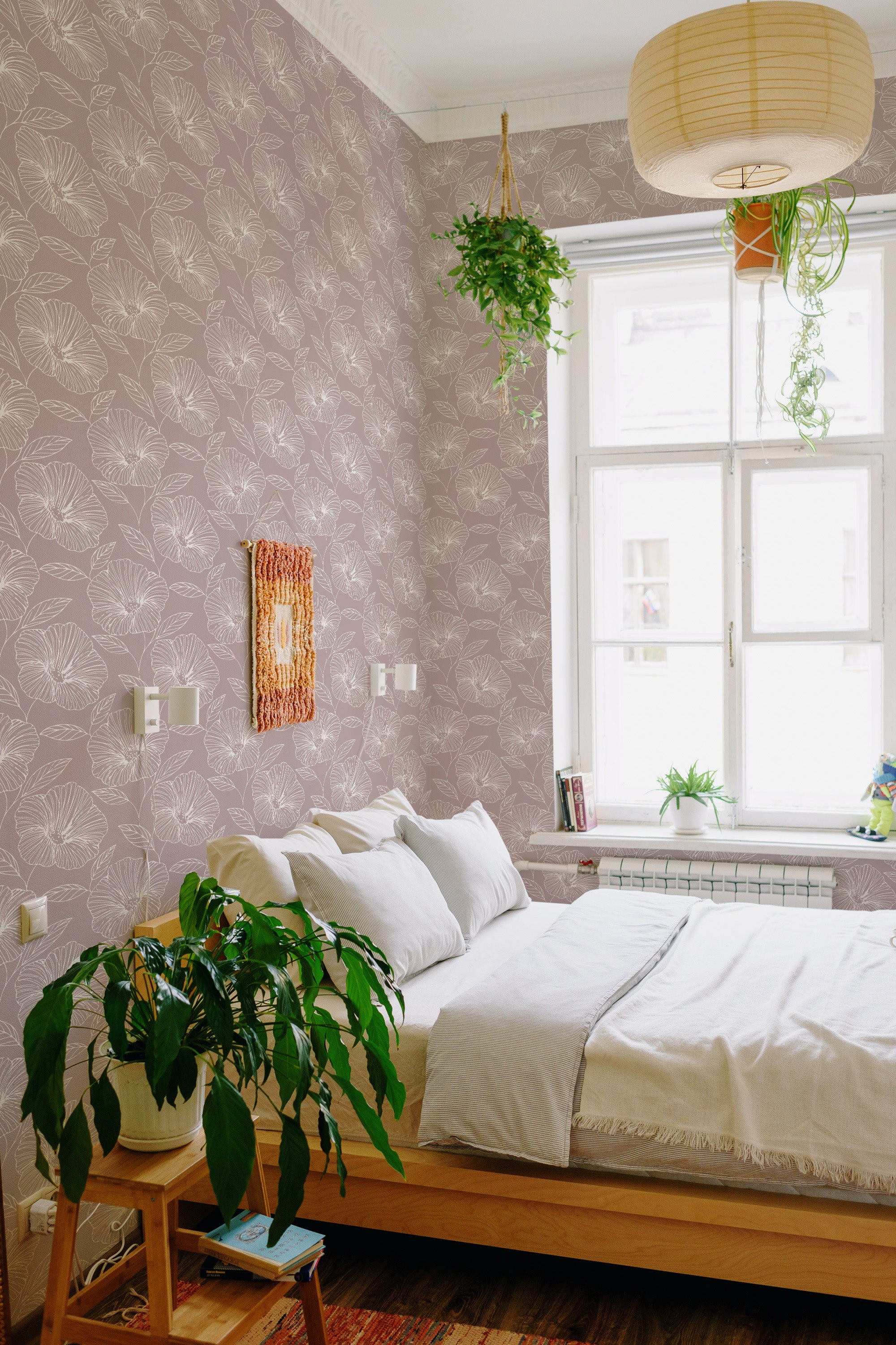 A room with Floral line art wallpaper, featuring intricate floral patterns in white against a light mauve background with a soft, elegant feel. Traditional wallpaper.