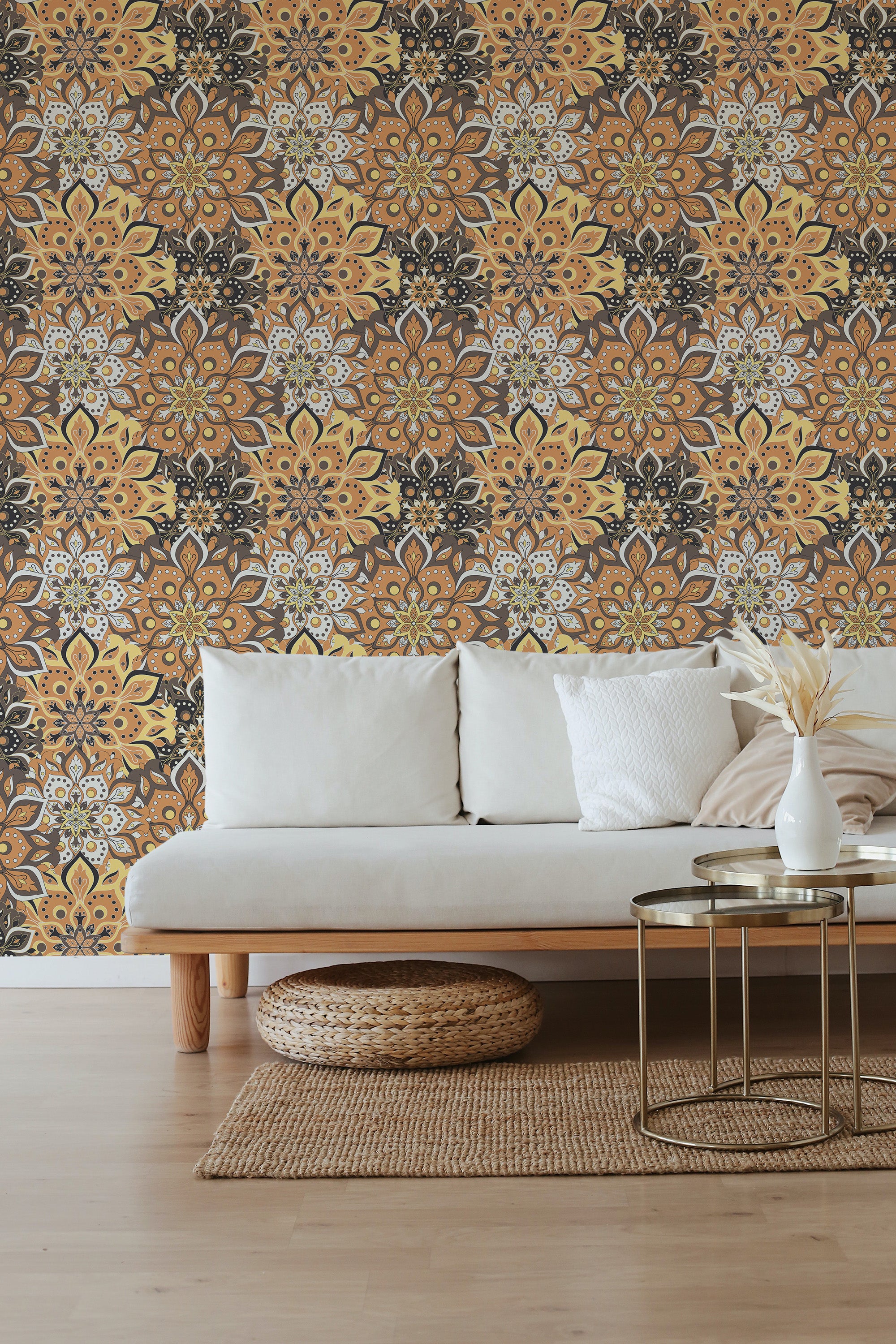 Colorful Mandala wallpaper with intricate patterns in orange, yellow, and black tones, forming symmetrical floral and geometric motifs, creating a vibrant and warm ambiance in the room. Traditional wallpaper.
