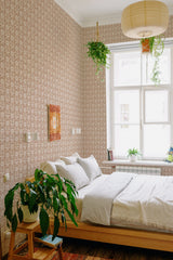Retro damask wallpaper with intricate symmetrical patterns in a neutral color palette, complementing the cozy and classic ambiance of the room. Traditional wallpaper.