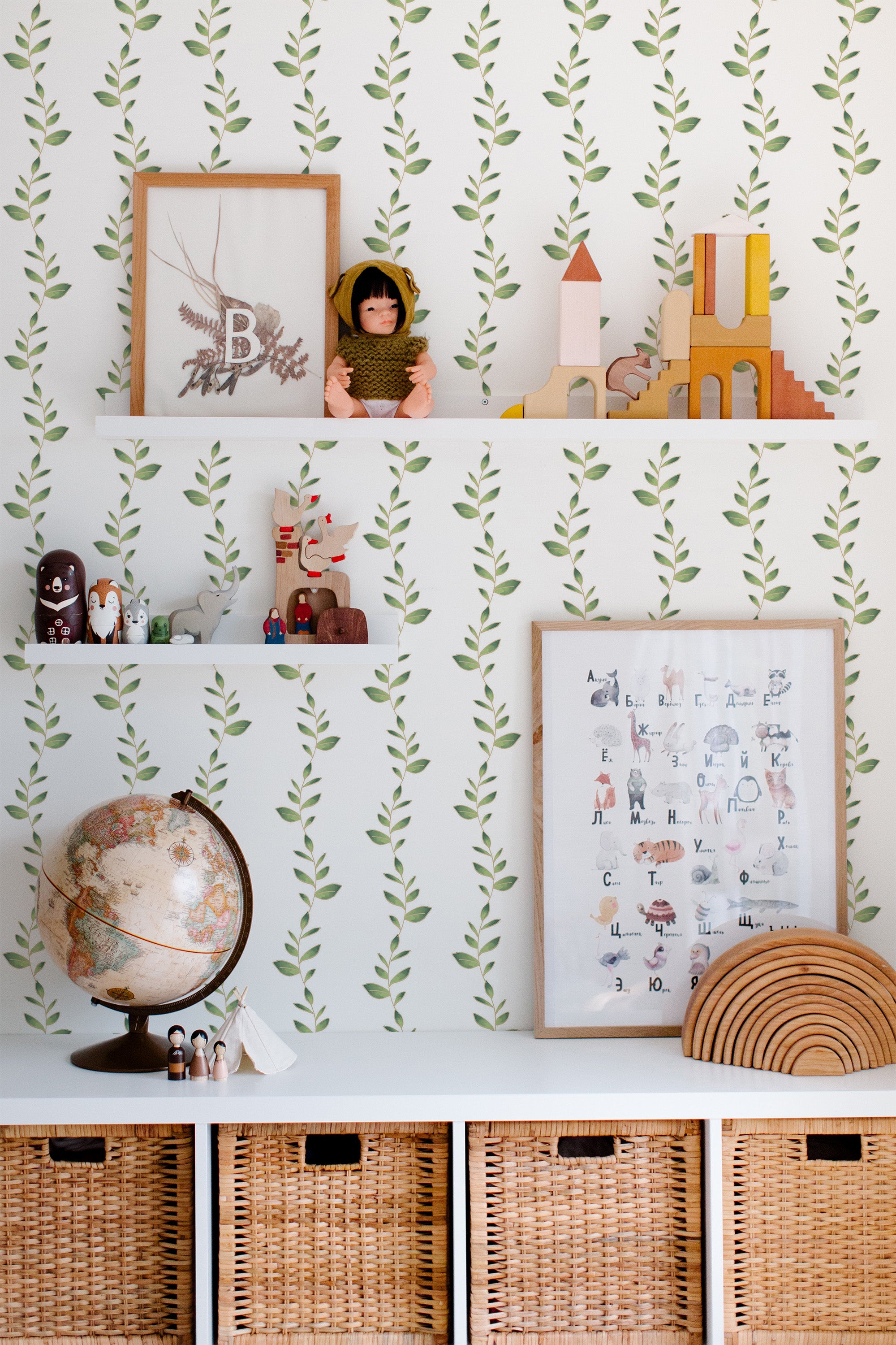 Self-adhesive wallpaper with a delicate Leaf String design, featuring small green leaves connected by thin stems on a light background, creating an elegant and natural aesthetic in the room.