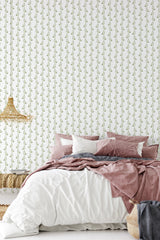A bedroom with a white wall covered in a Leaf string design, showing vertical rows of delicate green leaves. The traditional wallpaper.