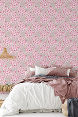 Soft pink cherry blossoms arranged in dense clusters against a pale mauve background, creating a serene and elegant atmosphere. Traditional wallpaper.
