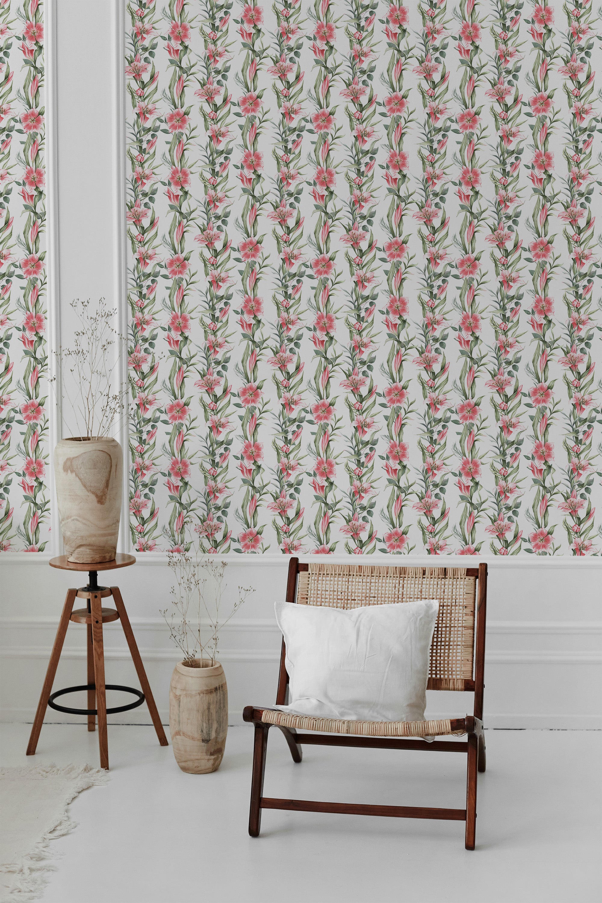 Floral pattern with pink lilies and green leaves intertwined on a white background, evoking a classic and elegant style. Traditional wallpaper.