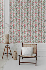 Floral pattern with pink lilies and green leaves intertwined on a white background, evoking a classic and elegant style. Traditional wallpaper.