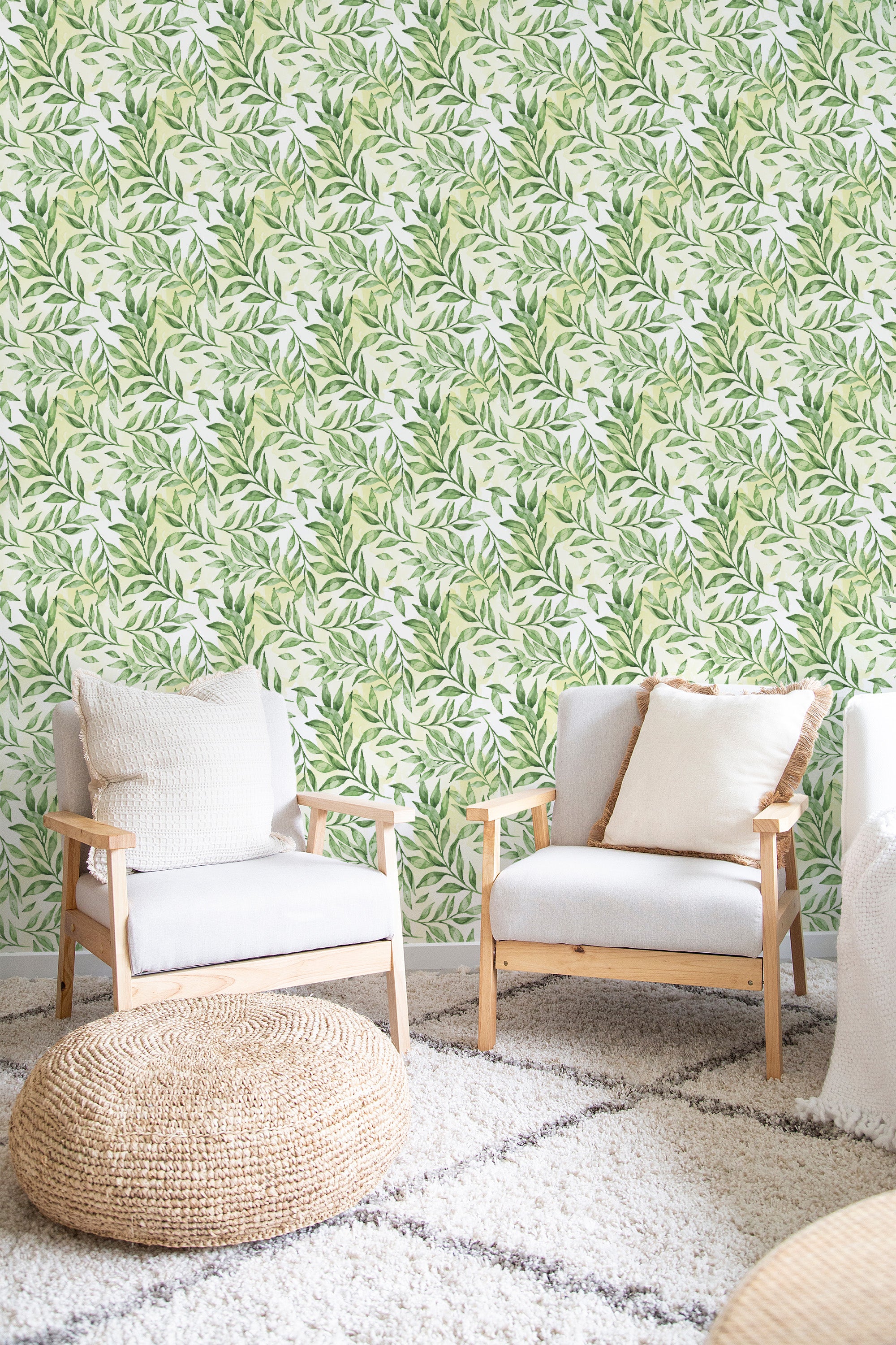 Green leafy pattern with detailed vines and leaves spread across a light background, in a traditional wallpaper.