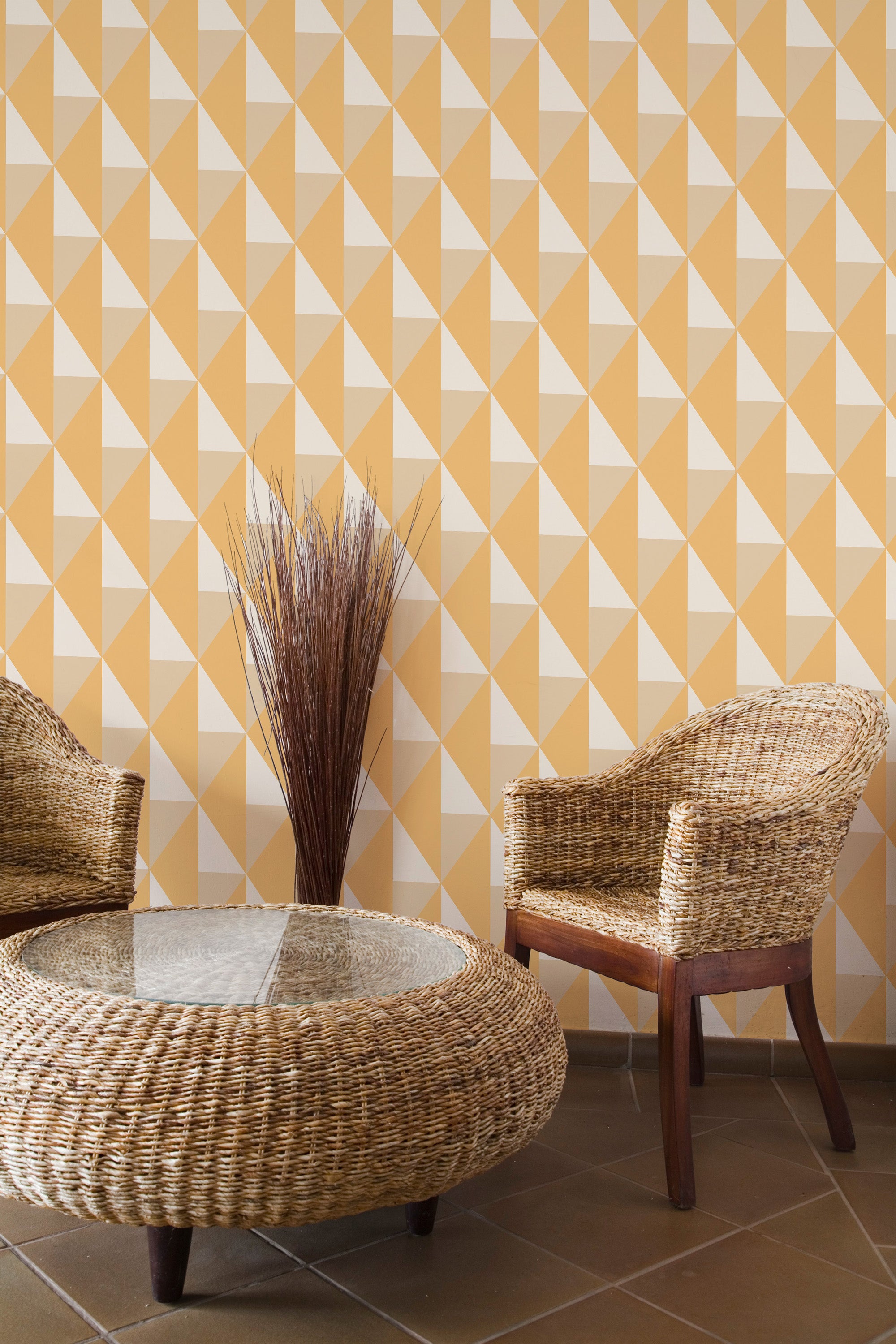 Self-adhesive wallpaper in a vibrant orange geometric pattern with a repeating design of triangular shapes in various shades of orange and white.
