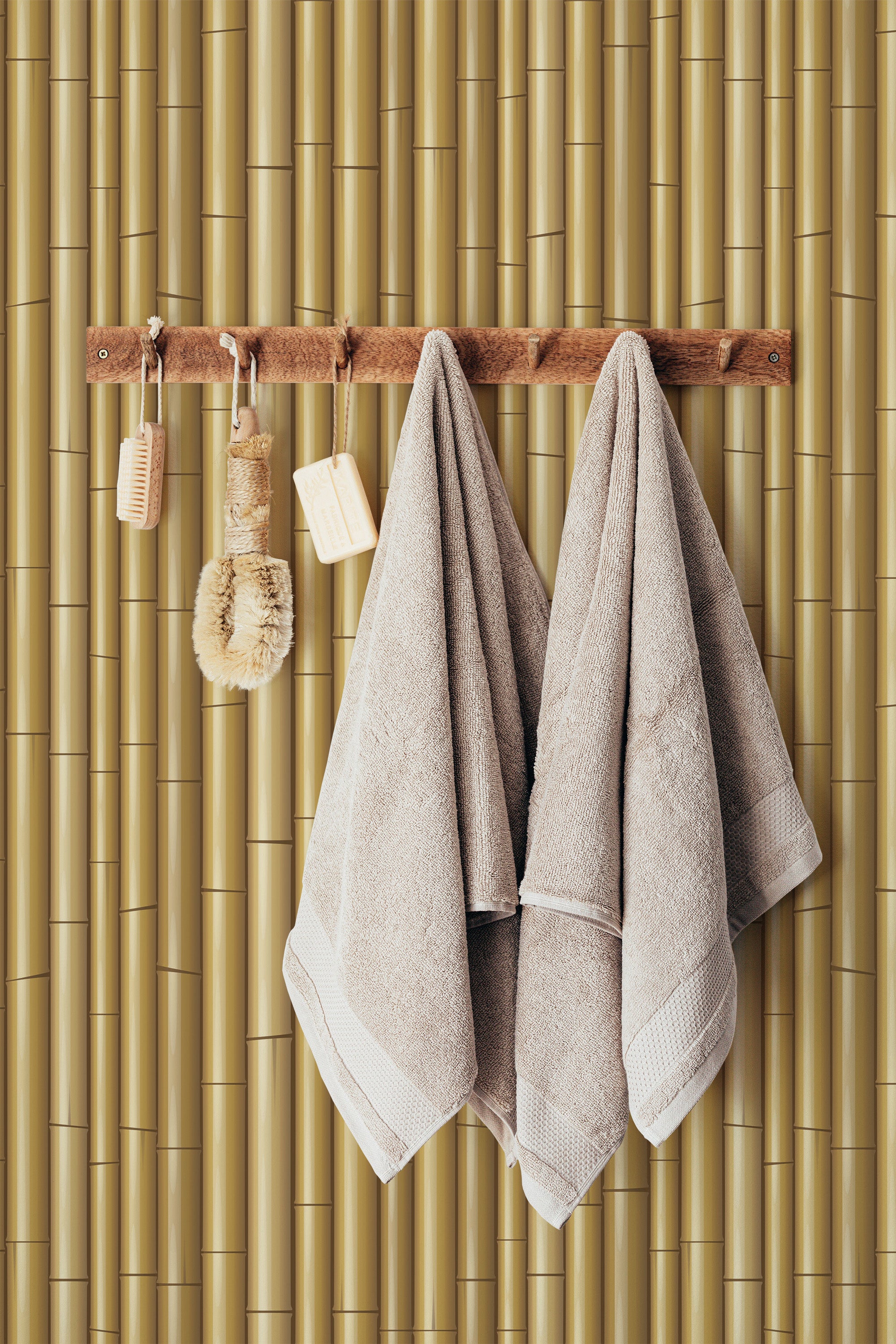 Self-adhesive wallpaper with a bamboo pattern featuring vertical stalks in varying shades of golden brown, giving a natural and textured appearance.