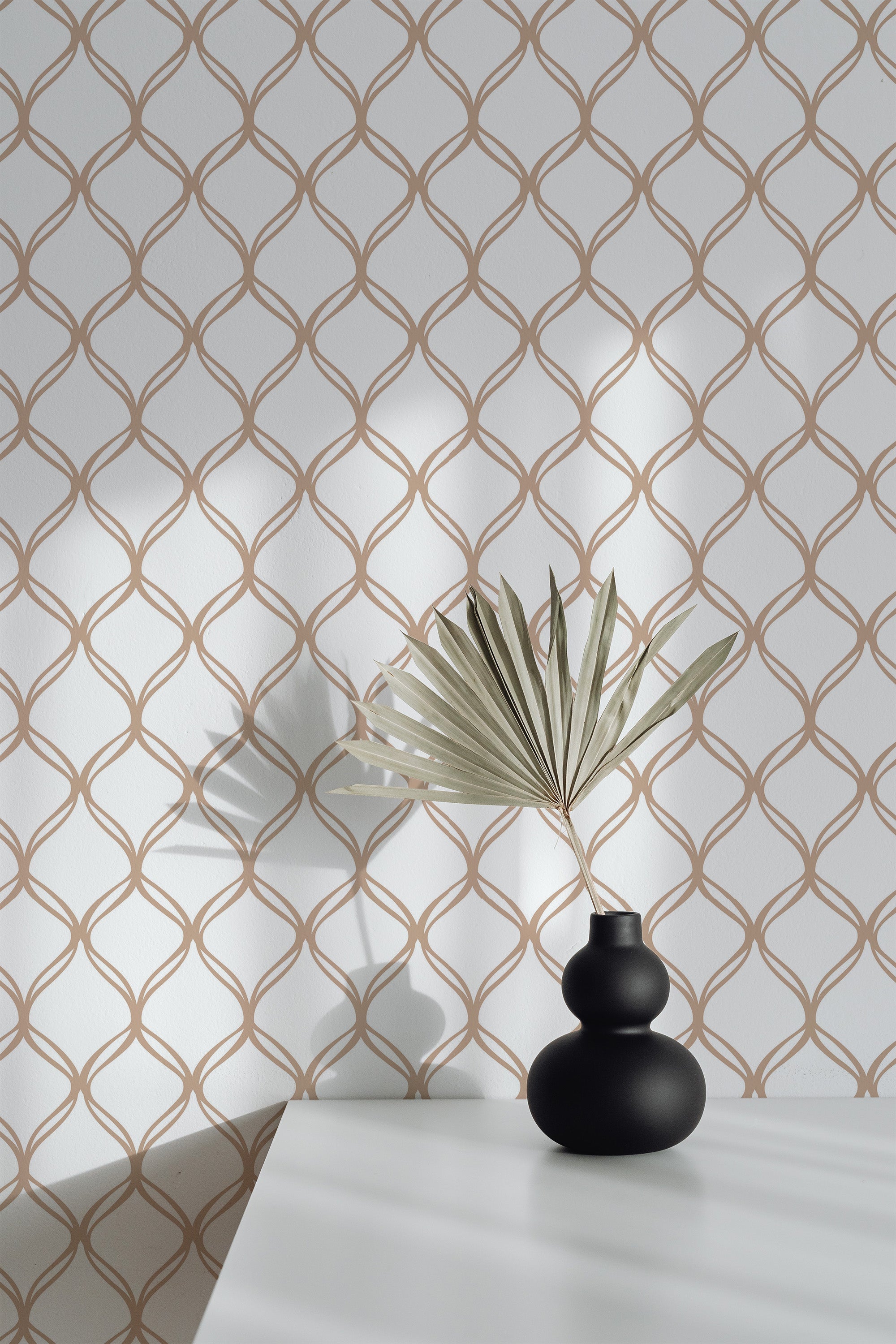 Self-adhesive wallpaper with an intricate traditional design of interlocking circles. The pattern features a warm, earthy color palette of soft beige and light brown against a white background.