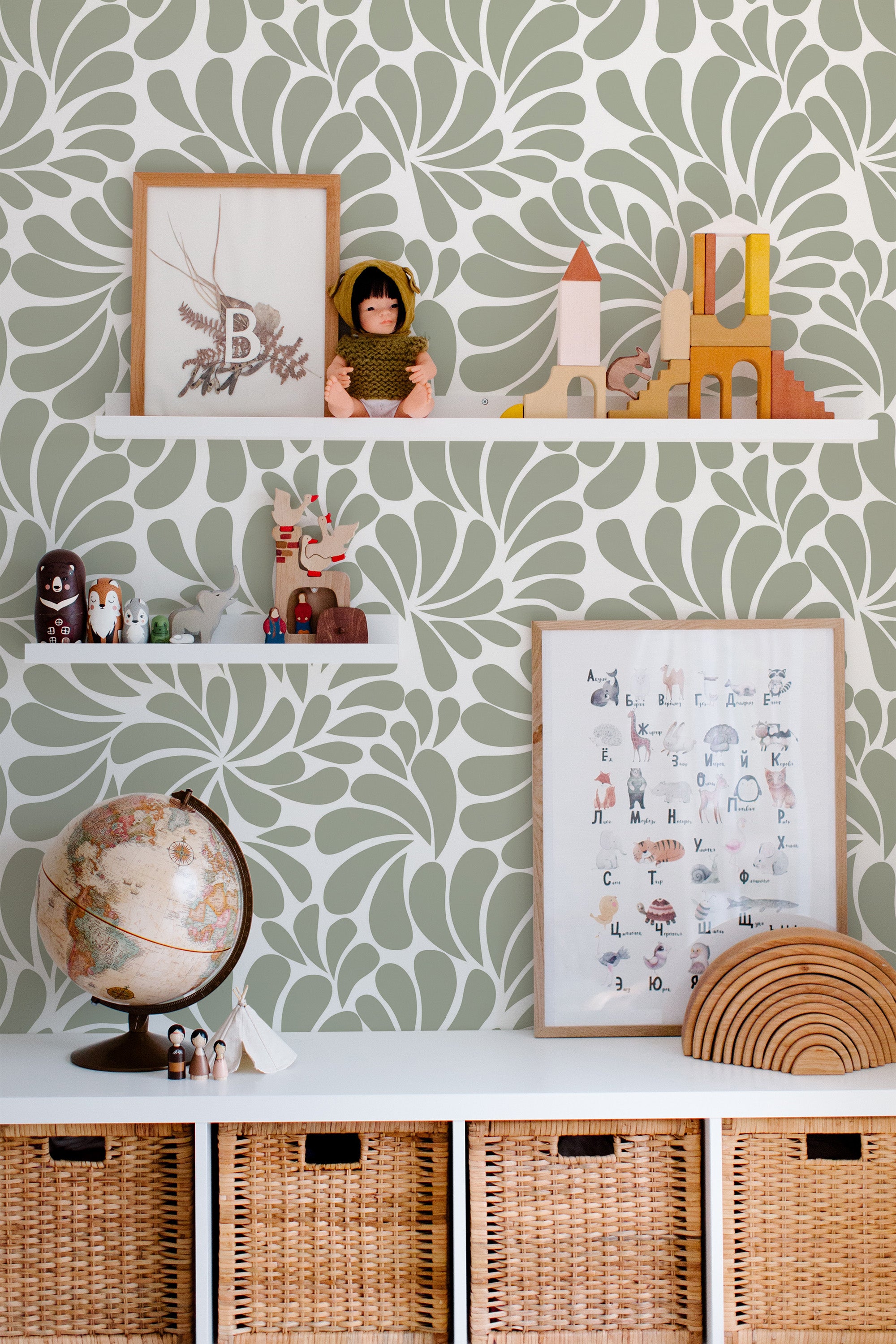 Self-adhesive wallpaper with a green and white Paisley design set in a swirling pattern, creating a dynamic backdrop.