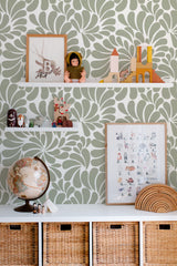 Self-adhesive wallpaper with a green and white Paisley design set in a swirling pattern, creating a dynamic backdrop.