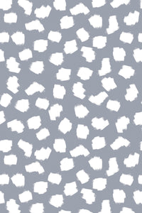 Gray background with irregular white brushstroke dots scattered evenly throughout, creating a playful and modern pattern. Peel and stick removable wallpaper.