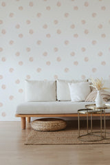 Beige dots evenly spaced on a white background, creating a minimalist and simple pattern on a traditional wallpaper.