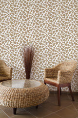 Self-adhesive wallpaper with a giraffe pattern, featuring a beige background with irregular white spots resembling a giraffe's skin, adds a safari-inspired vibe to the room.