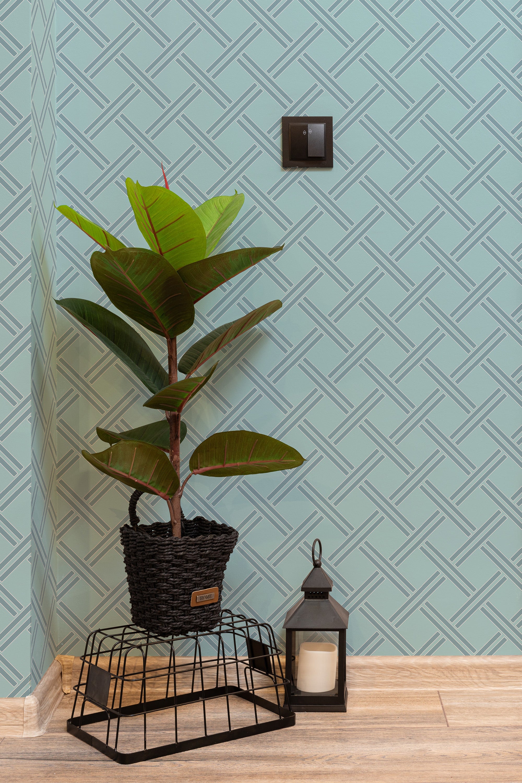 Self-adhesive light blue geometric wallpaper with a crisscross pattern in darker blue lines, creating a modern, stylish look.