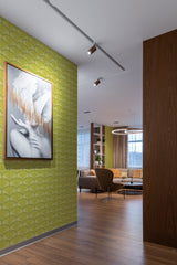 A room with walls adorned in Green Arch pattern wallpaper, characterized by a repetitive geometric design of green arches that form a subtle, delicate scalloped pattern. The wallpaper gives a nod to vintage aesthetics, adding a touch of elegance with its muted green tones and symmetrical arrangement, while maintaining the charm and texture of traditional wallpaper.