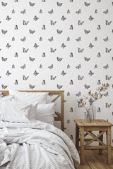 Self-adhesive wallpaper with a minimalist butterfly pattern, featuring delicate black butterflies scattered evenly on a simple, white background.