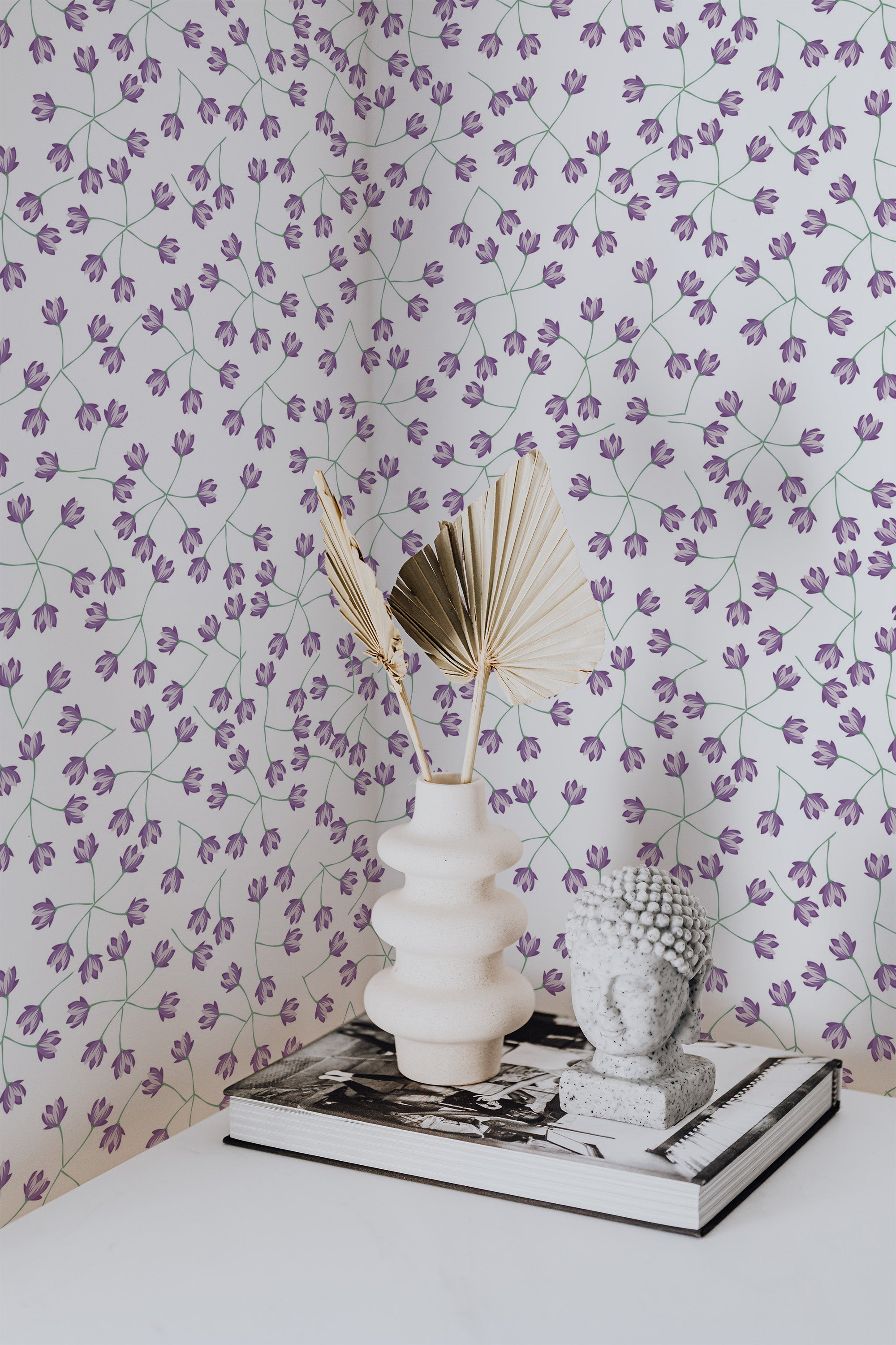 Self-adhesive wallpaper with a small floral pattern in purple, delicate flowers on thin, branching stems set against a white background, adding a touch of nature-inspired elegance to the room.