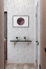 Light-colored wallpaper with a delicate pattern of ballet dancers in various graceful poses, repeated across the wall. Traditional wallpaper.
