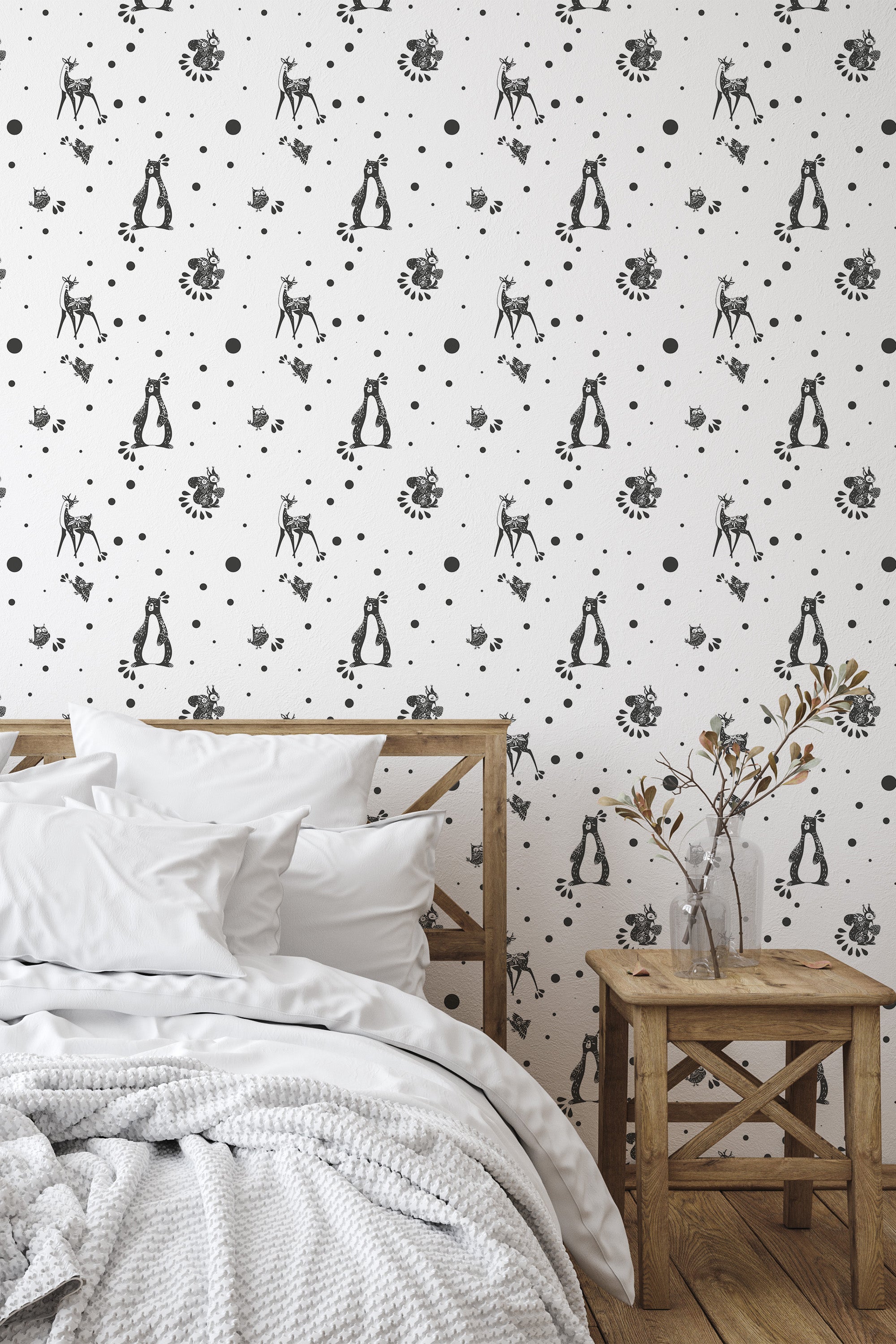 Self-adhesive wallpaper with a Scandinavian forest animal design, featuring black illustrations of penguins, deer, birds, and floral elements scattered across a white background.