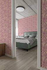 Wallpaper with a lively and symmetrical design in shades of pink, forming intricate, sun-like patterns on a pale background, adding a vibrant and whimsical touch to the room. Traditional wallpaper.