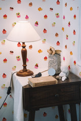 Self-adhesive wallpaper with a colorful cupcake pattern on a white background, featuring varying sizes and styles of cupcakes with vibrant sprinkles and frosting.